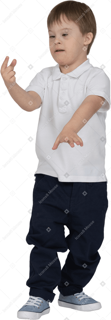 Front view of a boy looking at his hands
