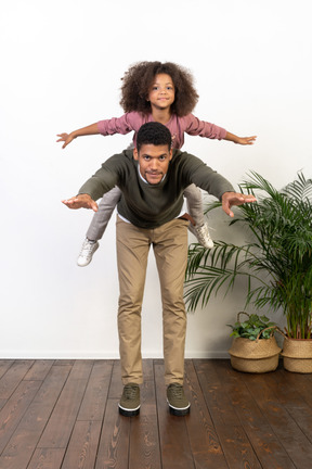 Good looking young man playing with a girl