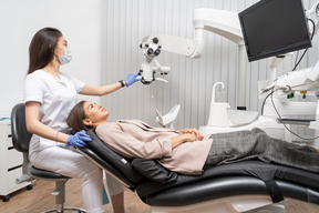 Full-length of a female dentist preparing for dental examination