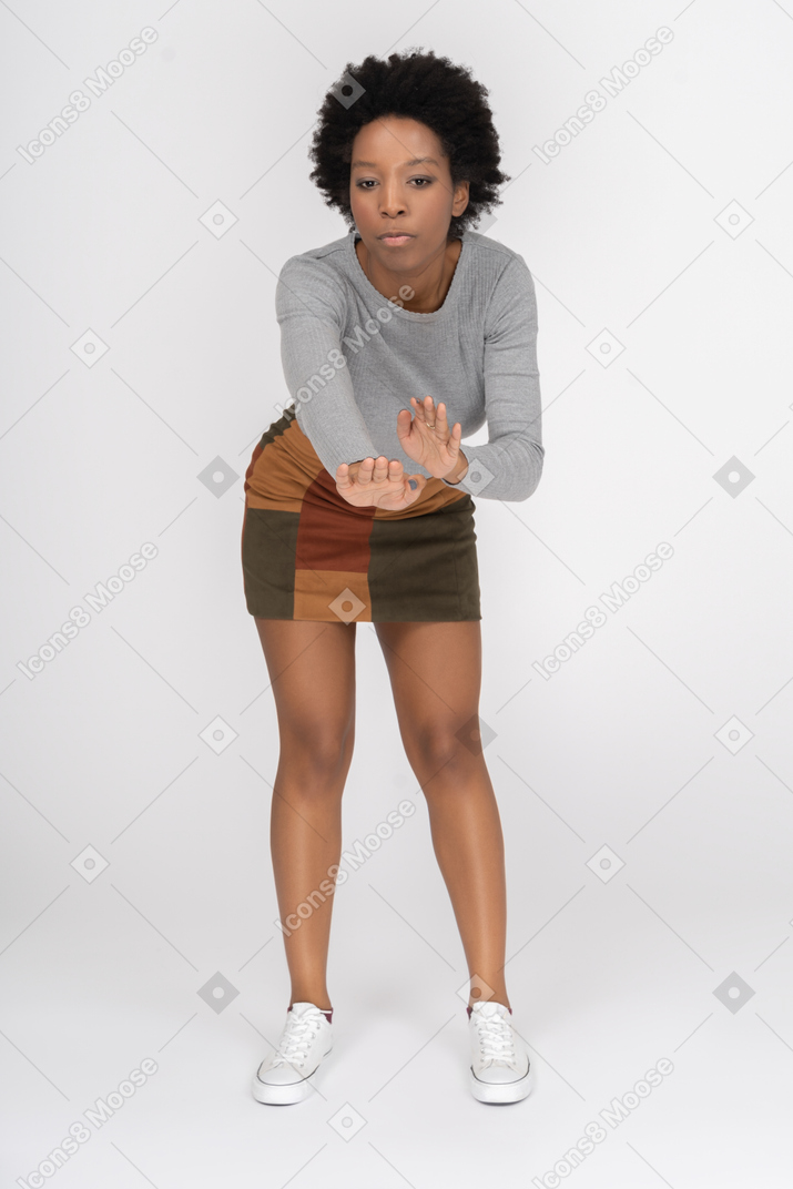 African girl moving her hands in a dance