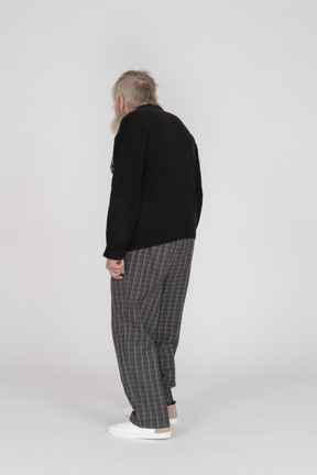 Back view of elderly man standing