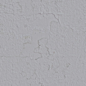 Mur de plâtre fissuré gris