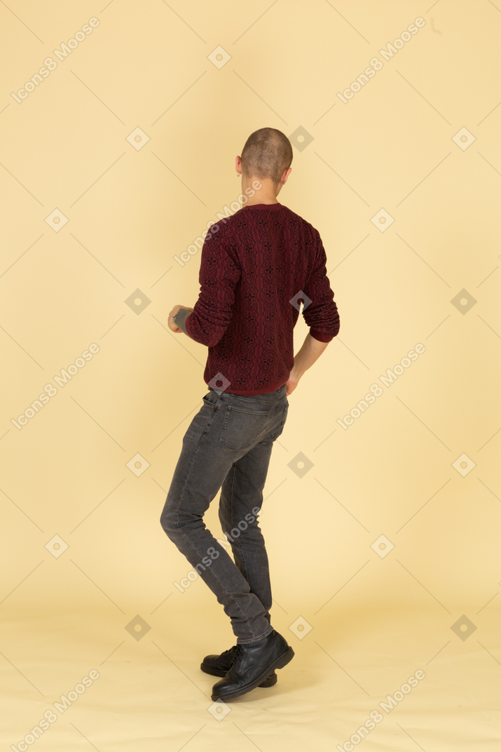 Back view of a young men in casual clothes