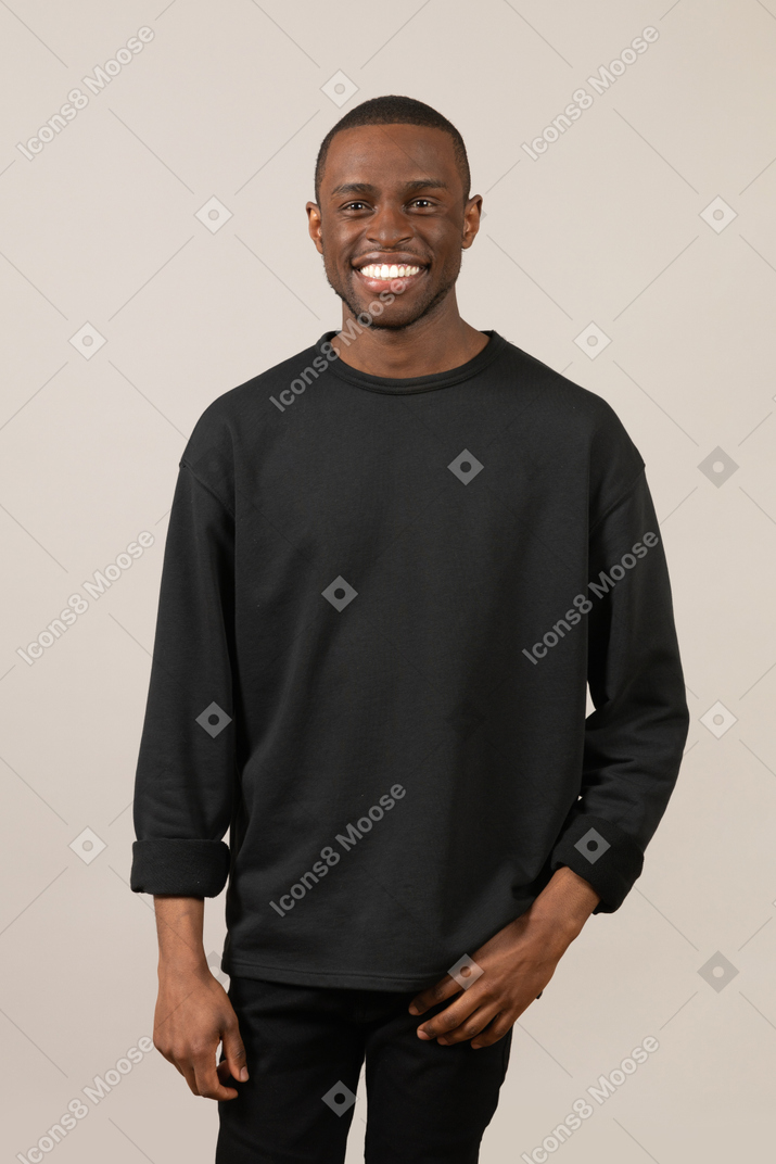 Young man smiling and looking at camera