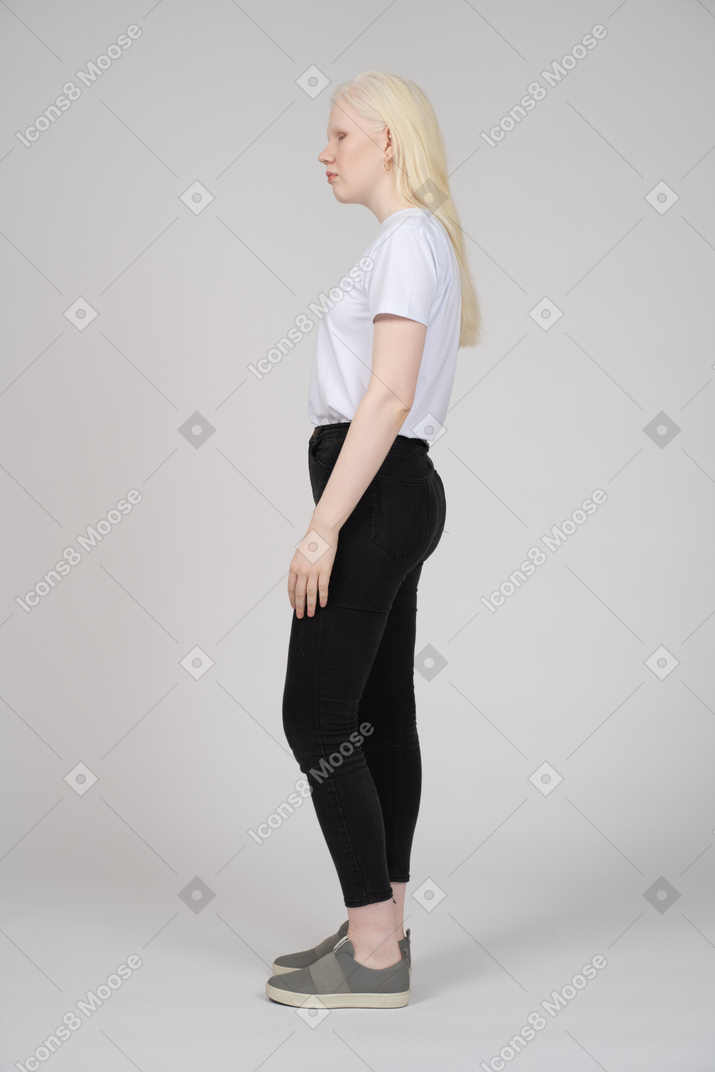 Side view of a young woman in casual clothes