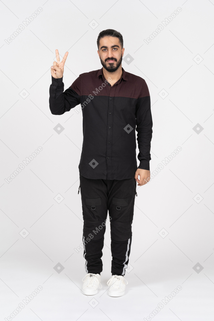Young man with peace gesture
