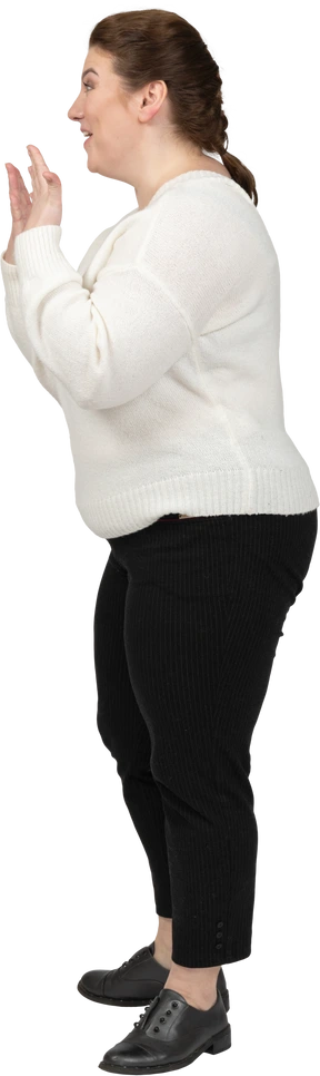 Extremely surprised plump woman in white sweater