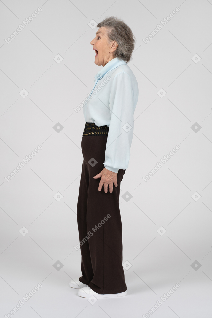 Side view of an old woman looking shocked