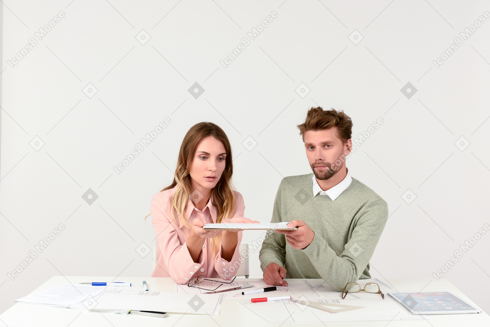 Architects sitting at the tablet and holding tablet