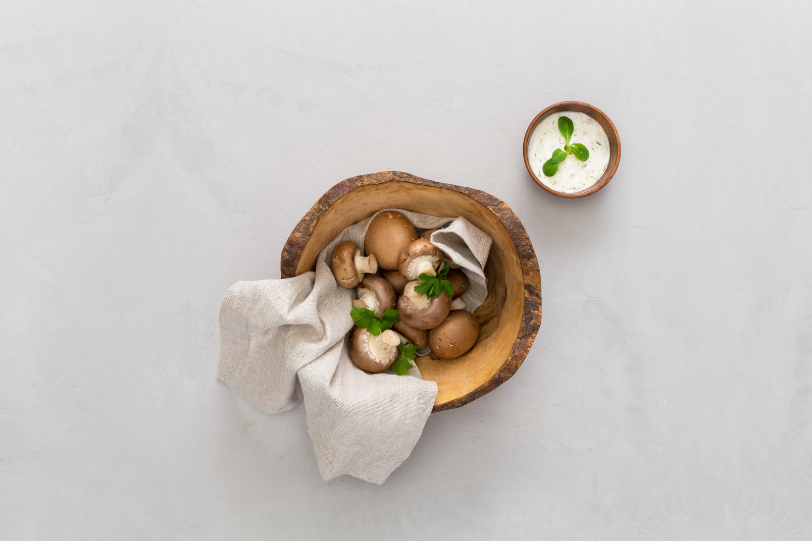 Mushrooms in wooden bowl and spices