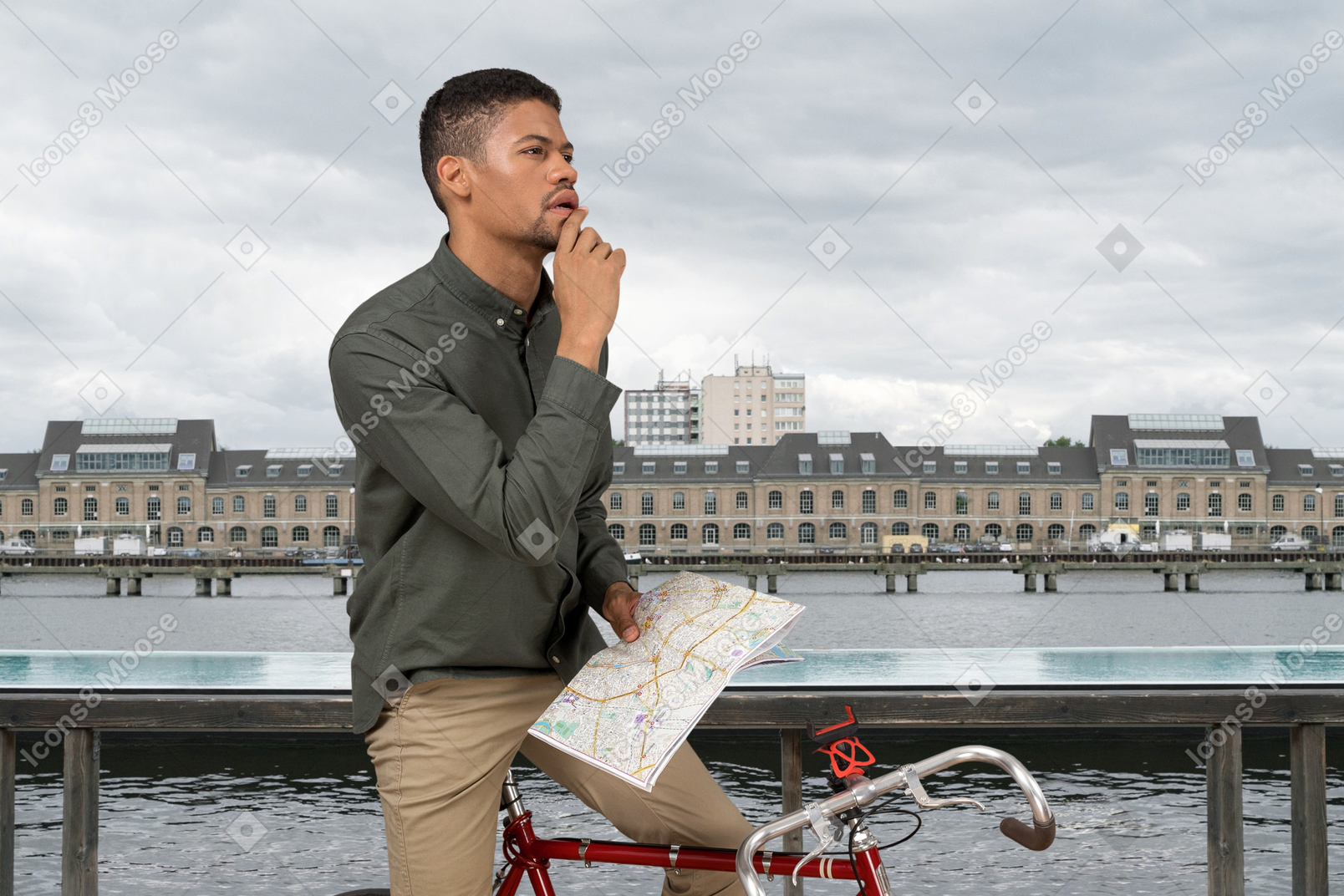 A man on a bike with a map in his hand