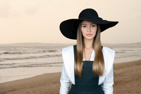 Beautiful young woman at the sea shore
