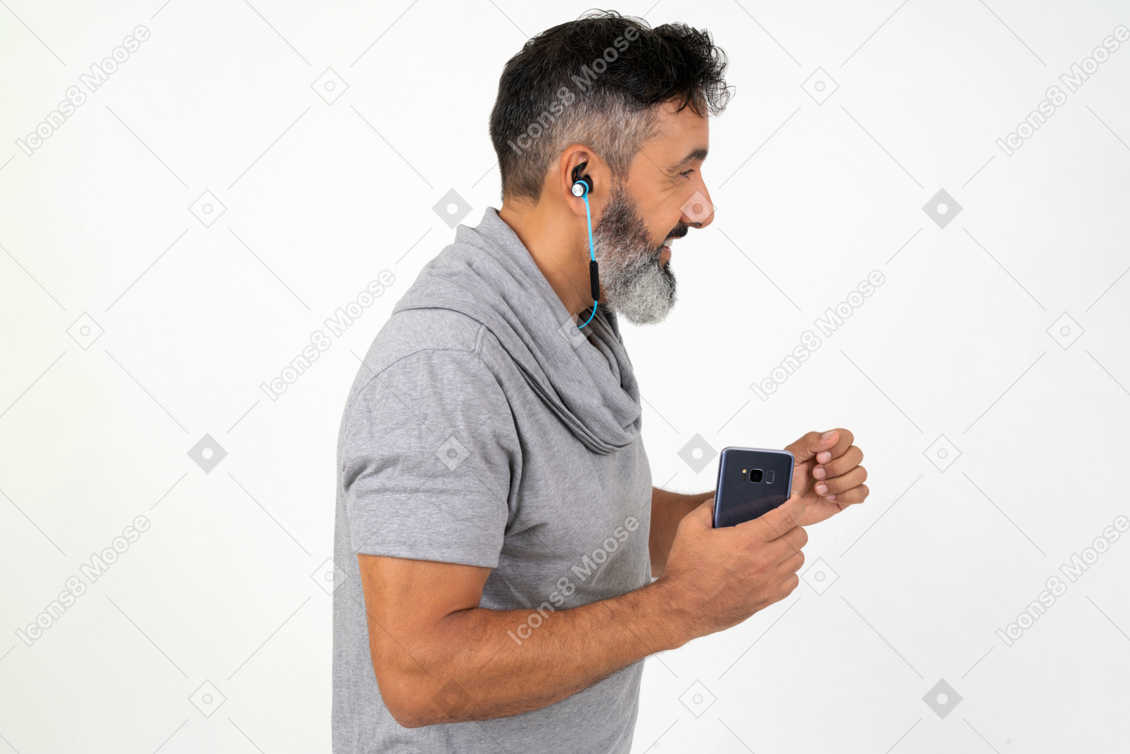 Mature man listening to music while running