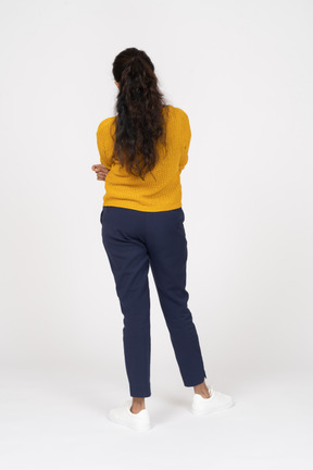 Back view of a girl in casual clothes