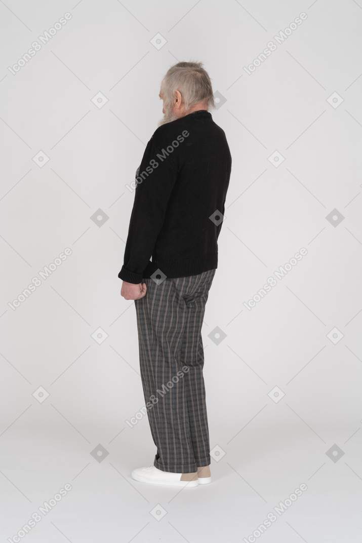 Three quarter back view of an old man