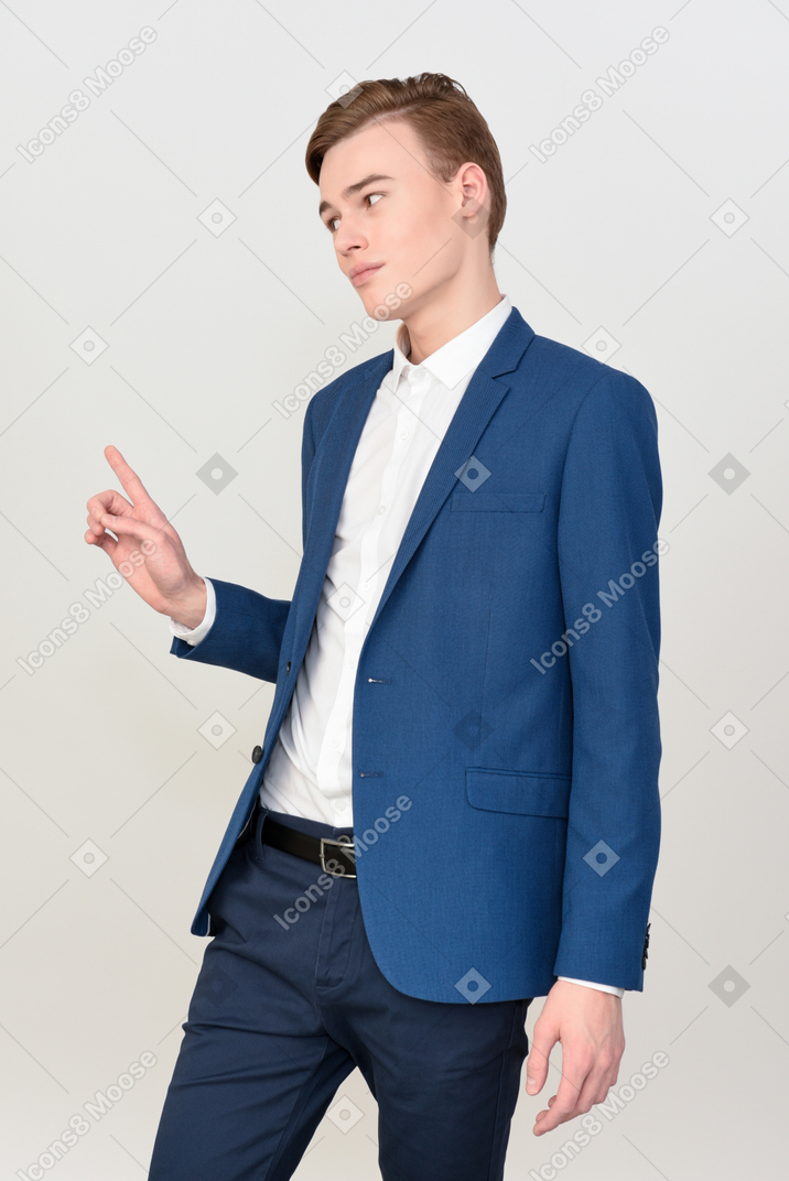 Handsome young man in suit seems to be objecting something