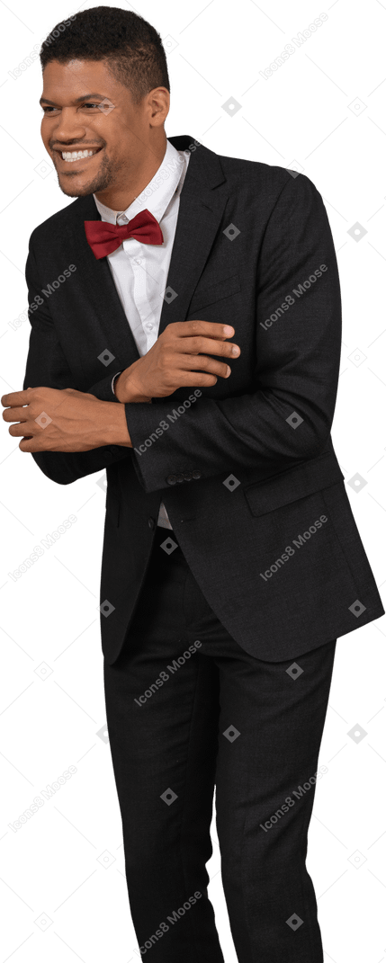 Man in black suit laughing