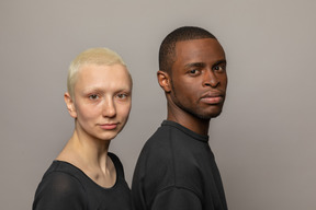 Young international couple looking at camera