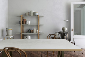 Room with a large table and ceramic pots and vases