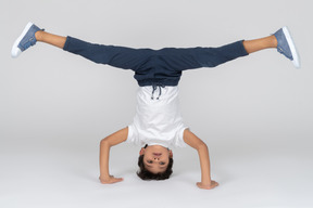 A boy standing on his head