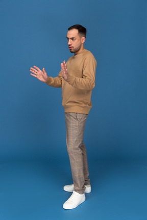 Young man with raised hands