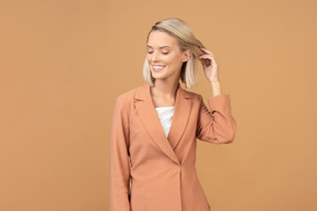 Happy young woman in terracotta jacket