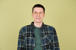 Young man wearing glasses and a checkered shirt
