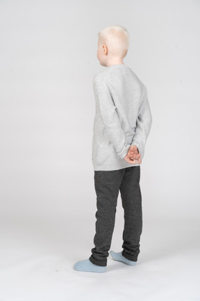 Full-length of an offended little boy in casual clothes