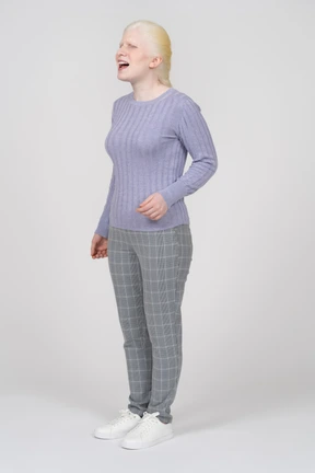 Front view of a laughing woman in casual clothes