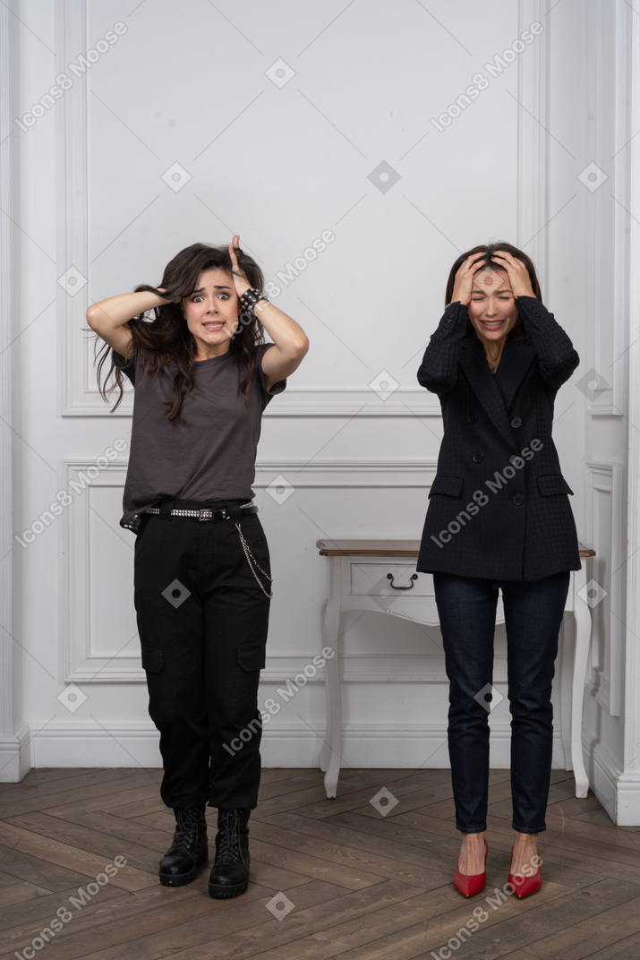 Two women looking terrified