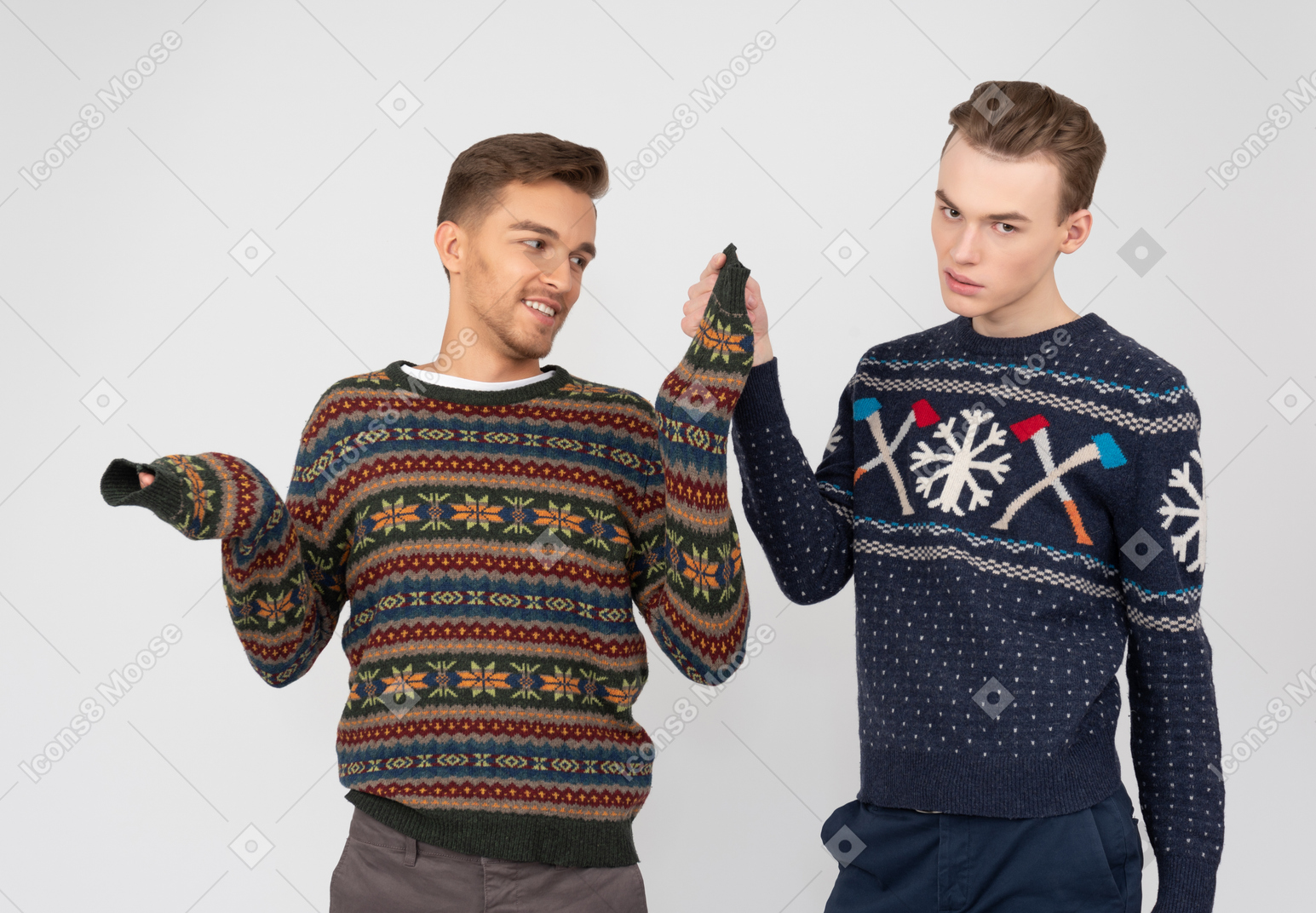 Brother trying to take off his brother's sweater