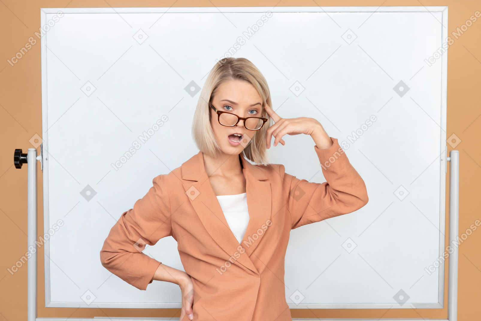 Attractive woman standing holding her finger next to her head