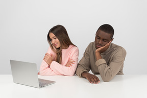 Attractive couple watching some show online together