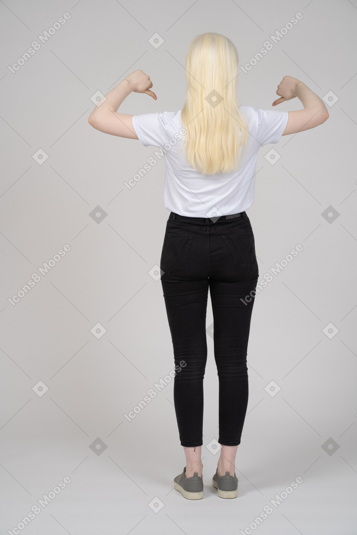 Back view of a young girl with two thumbs down