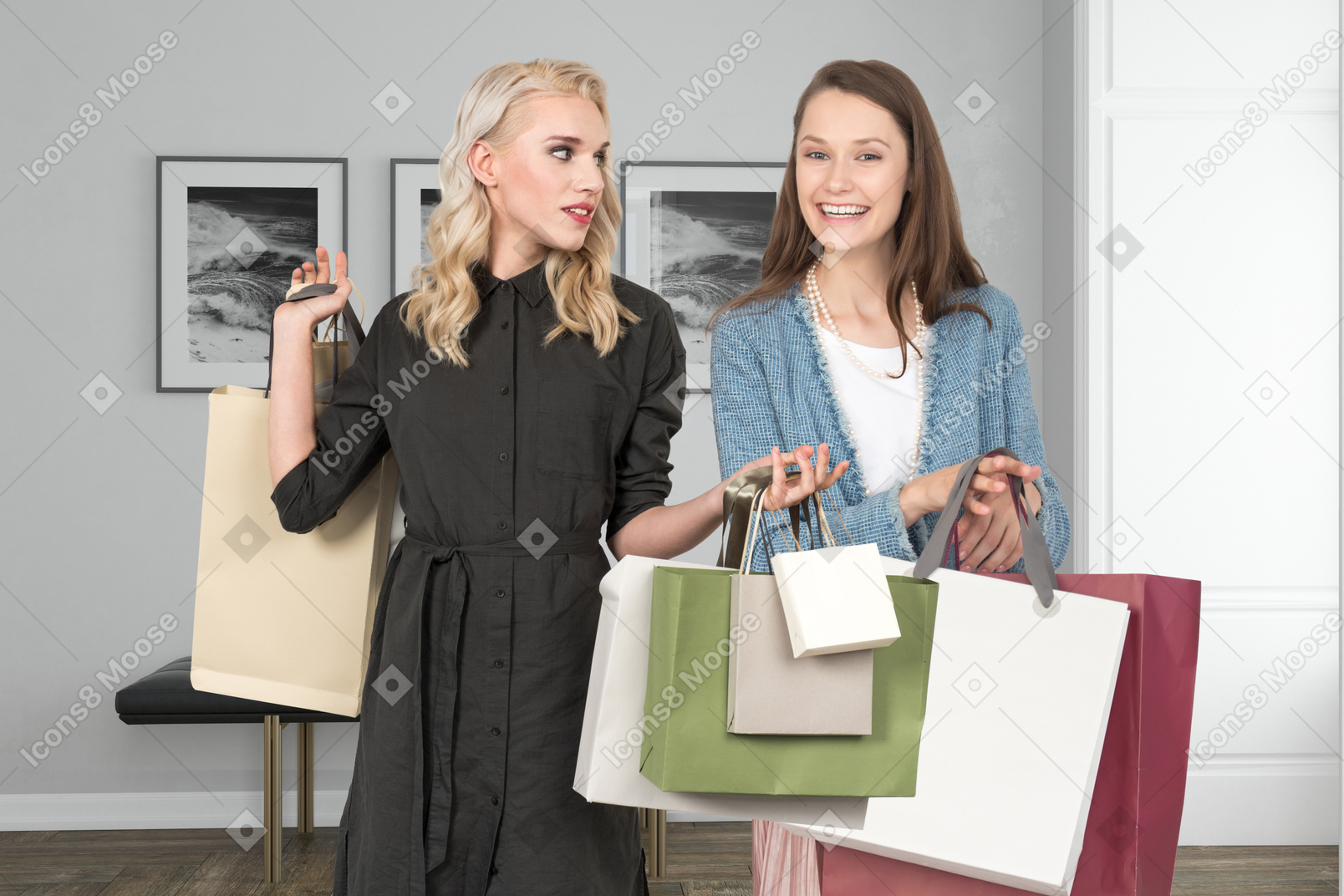 Woman and person holding shopping bags in a room