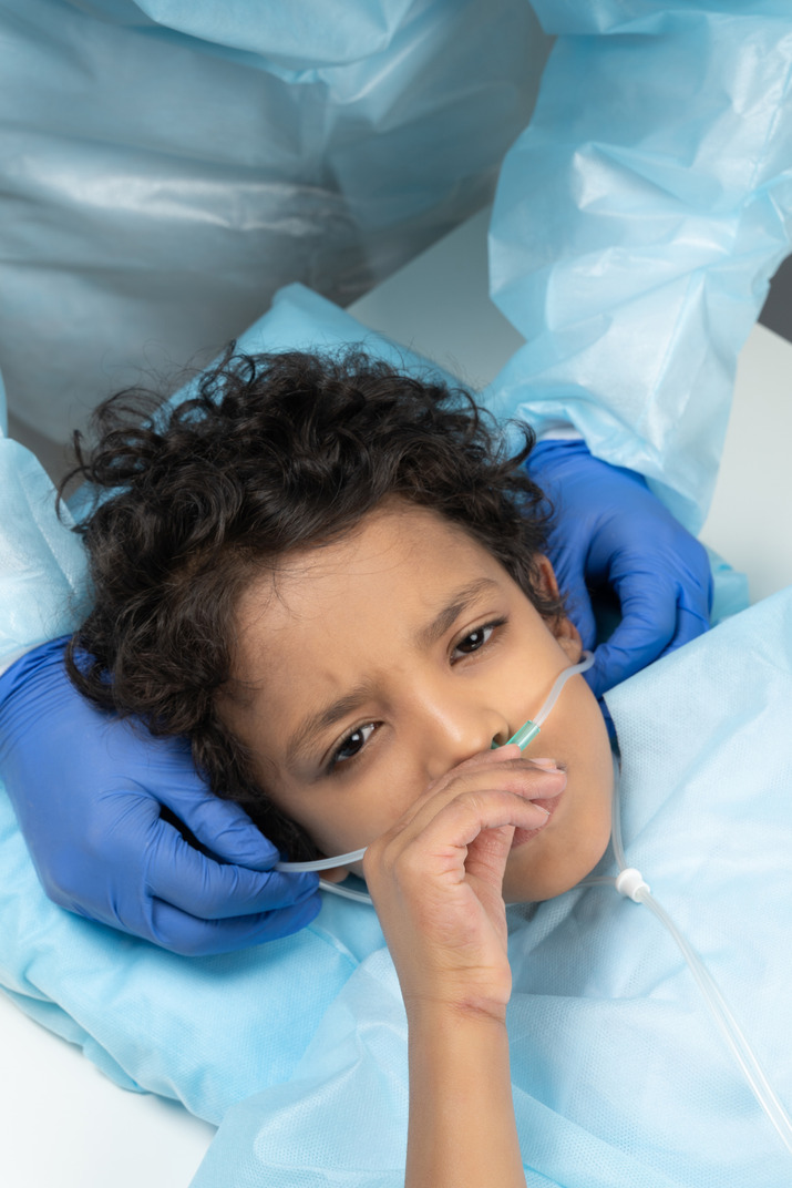 Kid with nasal cannula