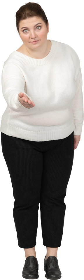 Plus size woman in casual clothes making welcoming gesture