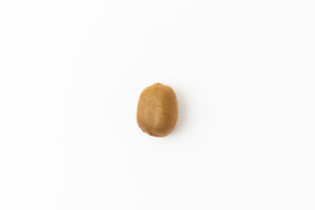 Single kiwi on white background