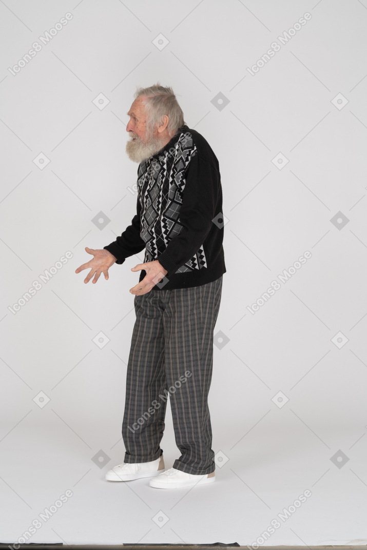 Side view of old man with spread arms