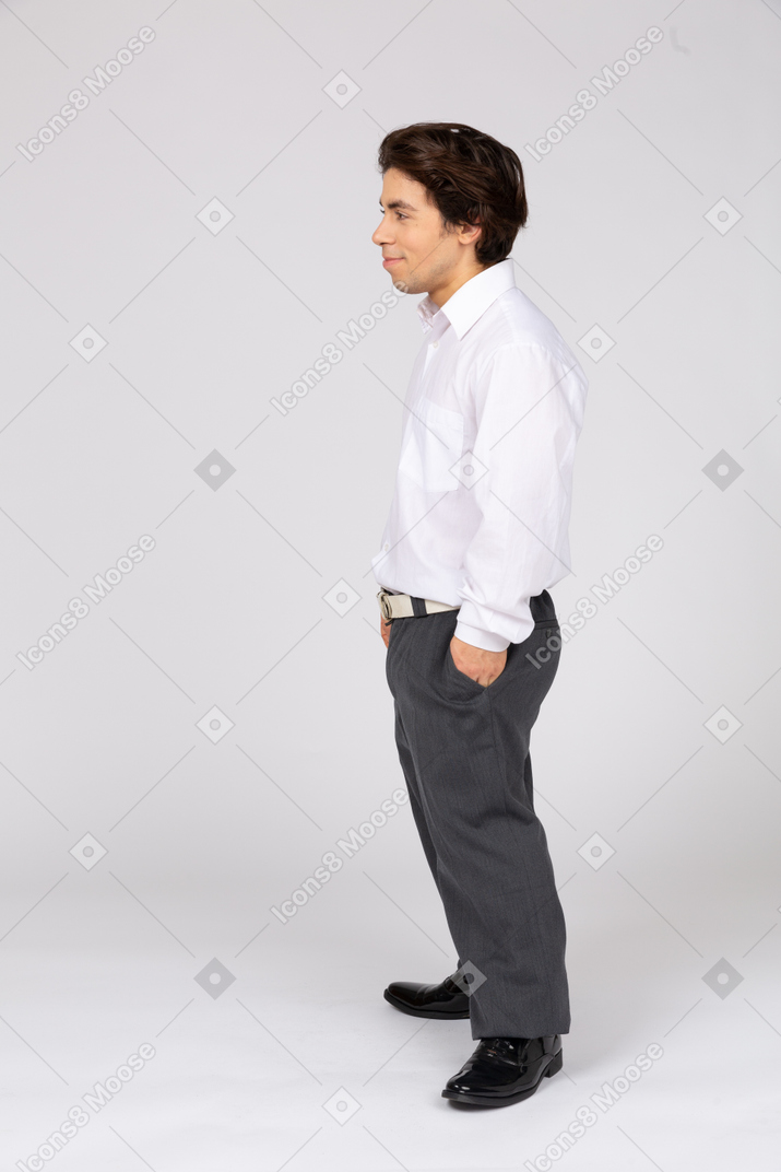 Smiling man with hand in pocket