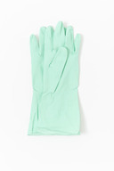 Light blue rubber gloves lying on the plain white background