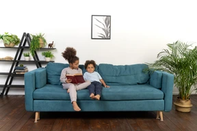 Cute boy and girl reading the book