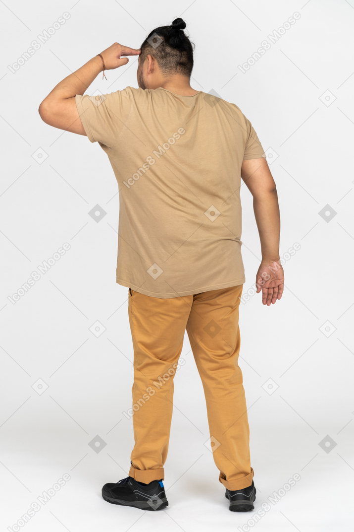 Portrait of plus size asian man looking far away isolated on white