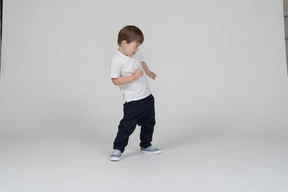 Three-quarter view of a boy dodging slightly
