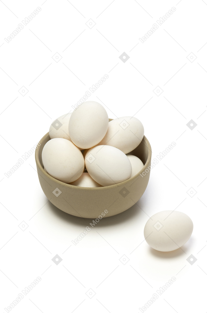 Chicken eggs in a ceramic bowl
