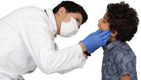 Doctor examining boy's teeth