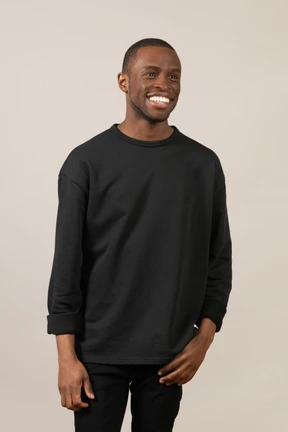 Young man smiling and looking aside