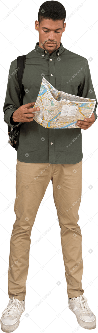 Front view of a man looking at a map in confusion