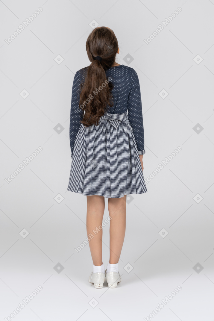 Rear view of a girl with her head tilted back