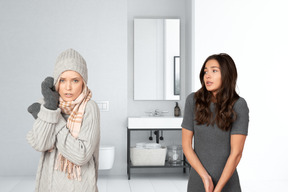 Women feeling cold in the bathroom